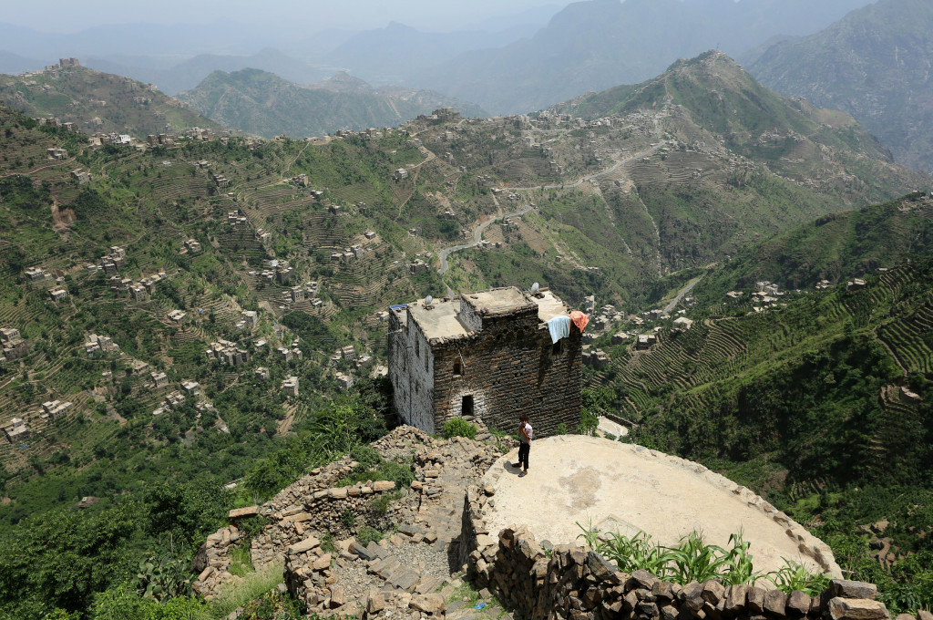 A boy stands on the roof of a pond in the mountains, in the Jafariya district of the western province of Raymah, Yemen June 2, 2016. Reuters Photo/Abduljabbar Zeyad