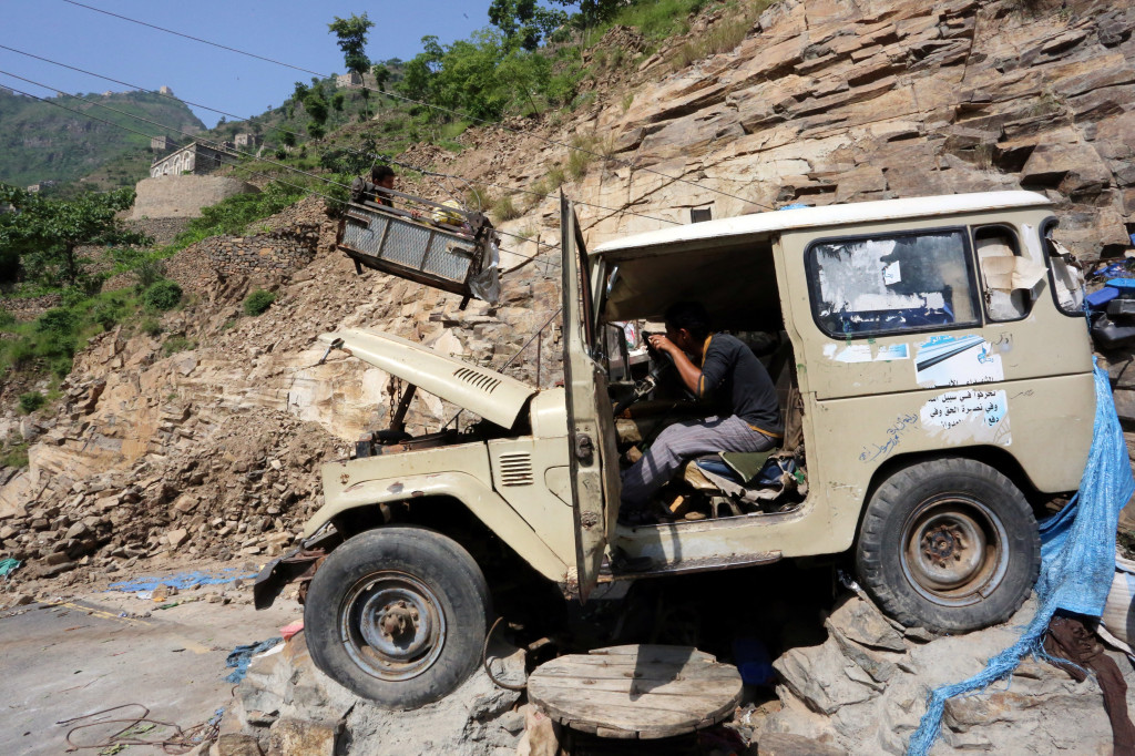 A cable car operator uses a vehicle engine to run the cable car that carries people and supplies to Dhalamlam Mountain in the Jafariya district of the western province of Raymah, Yemen May 20, 2016. Reuters Photo/Abduljabbar Zeyad