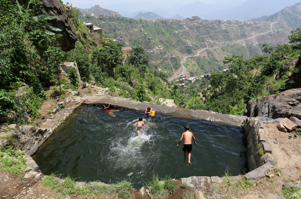 Boys swim in a pond in the mountains, in the Jafariya district of the western province of Raymah, Yemen June 2, 2016. Reuters Photo/Abduljabbar Zeyad