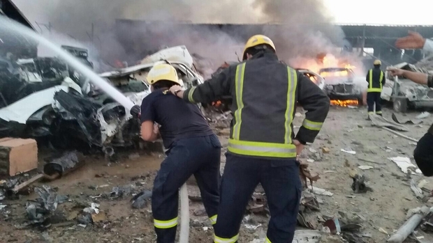 Firefighters in Saudi Arabia's Najran City tackle a blaze caused by rockets fired from Yemen (MEE)