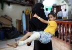 A woman carries a boy to a hospital in Taiz, Yemen. He was injured in an attack by the Houthi rebel group.
Anadolu Agency/Getty Images