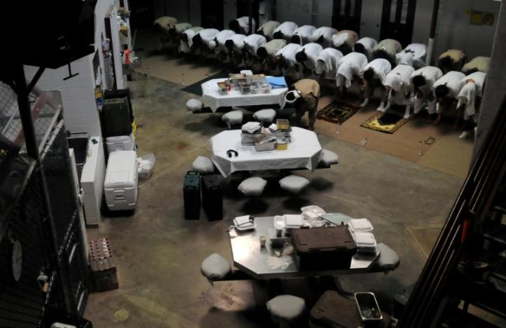 Detainees pray in a communal area of Camp Six  at Guantanamo Bay naval base in a March 18, 2011 file photo provided by the US Department of Defense.  /DoD/Petty Officer 1st Class David P. Coleman/Handout via Reuters/File Photo