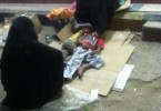 A woman with her children sleeping on the street in Aden