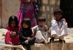 Yemeni children, who fled with their family from the city of Sirwah due to the fighting between Huthi rebels and militiamen loyal to Yemen's fugitive President Abderabbo Mansour Hadi, sit outside their shelter on April 24, 2015, on the outskirts of the Mareb province. AFP PHOTO / TAHA SALEH / AFP PHOTO / TAHA SALEH
